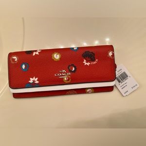 Brand new with tags beautiful red coach checkbook holder.
